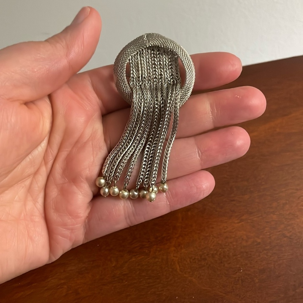 Silver dangling brooch